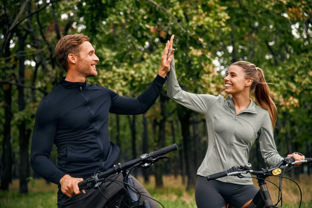 a joyful couple is highfiving each other during th utc